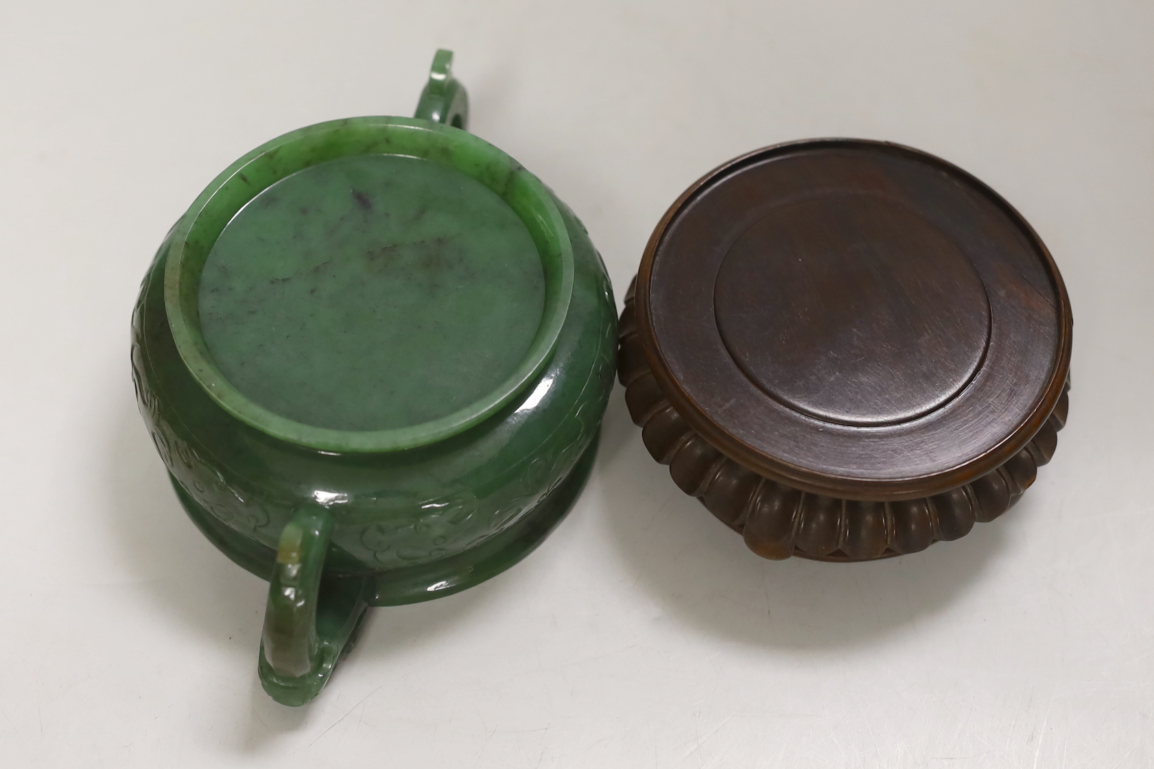 A Chinese archaistic green jade censer, wood stand. 10cm tall incl. stand